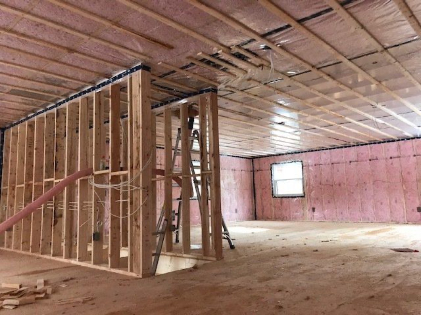 Large building interior with the walls insulated before finishing