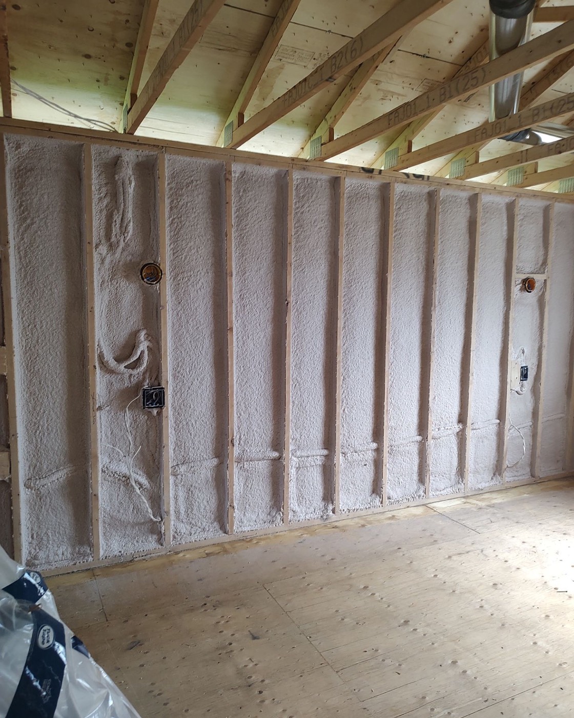 Interior walls of a recent project covered in spray foam insulation