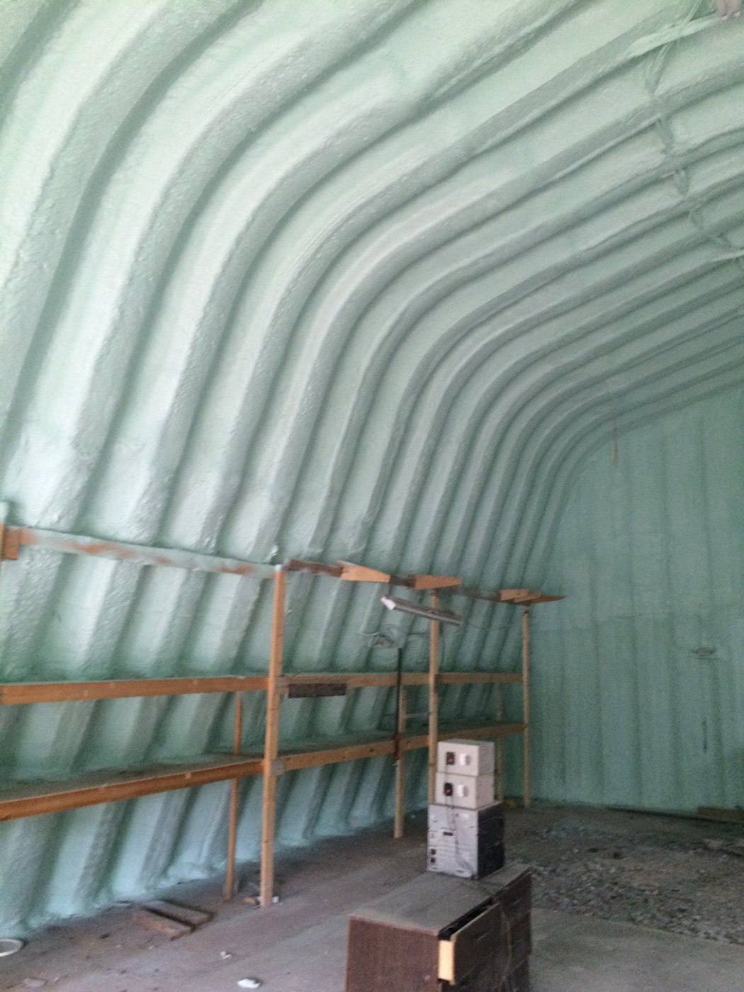 Interior of a Quonset hut garage insulated with continuous spray foam