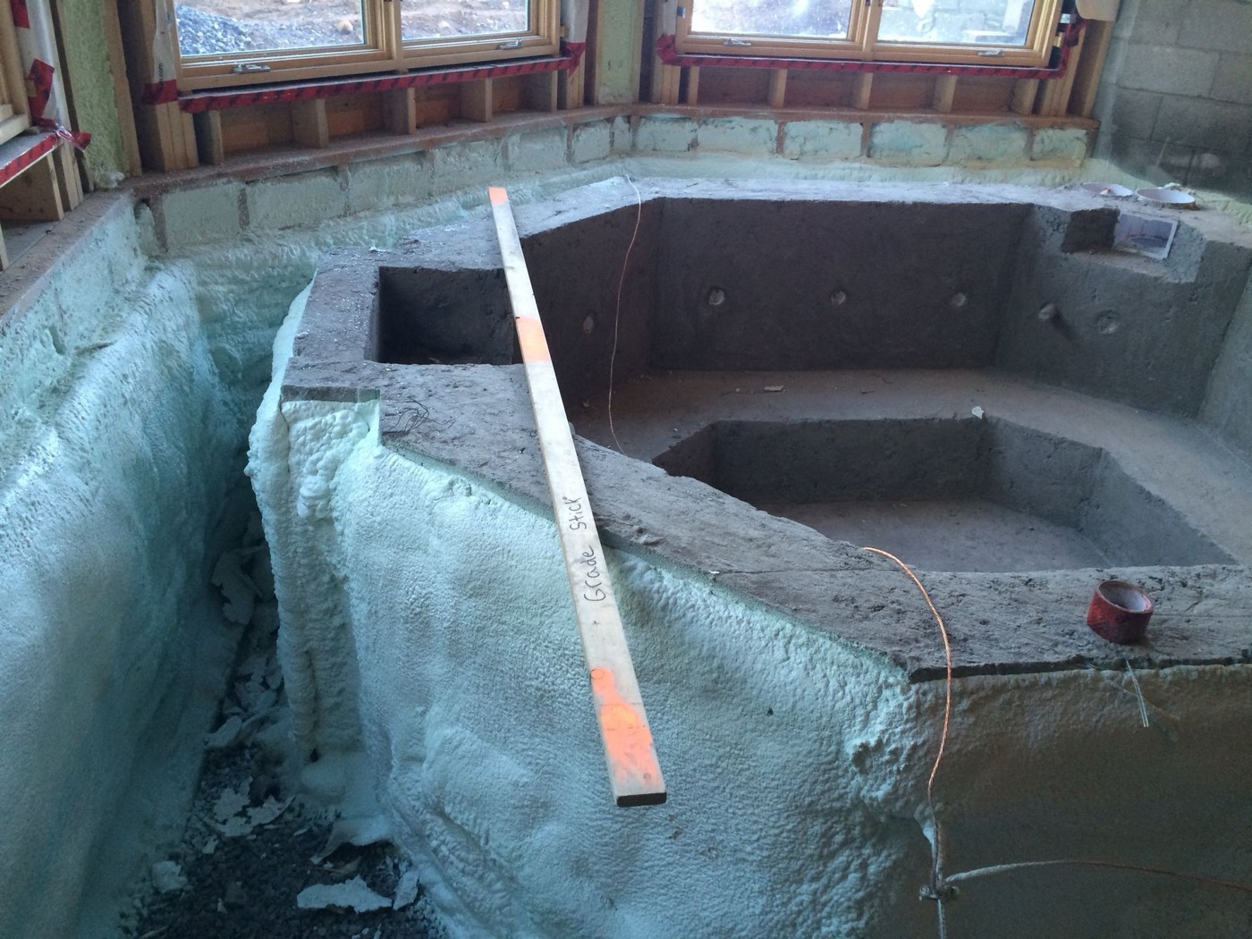 Hot tub surround insulated with spray foam