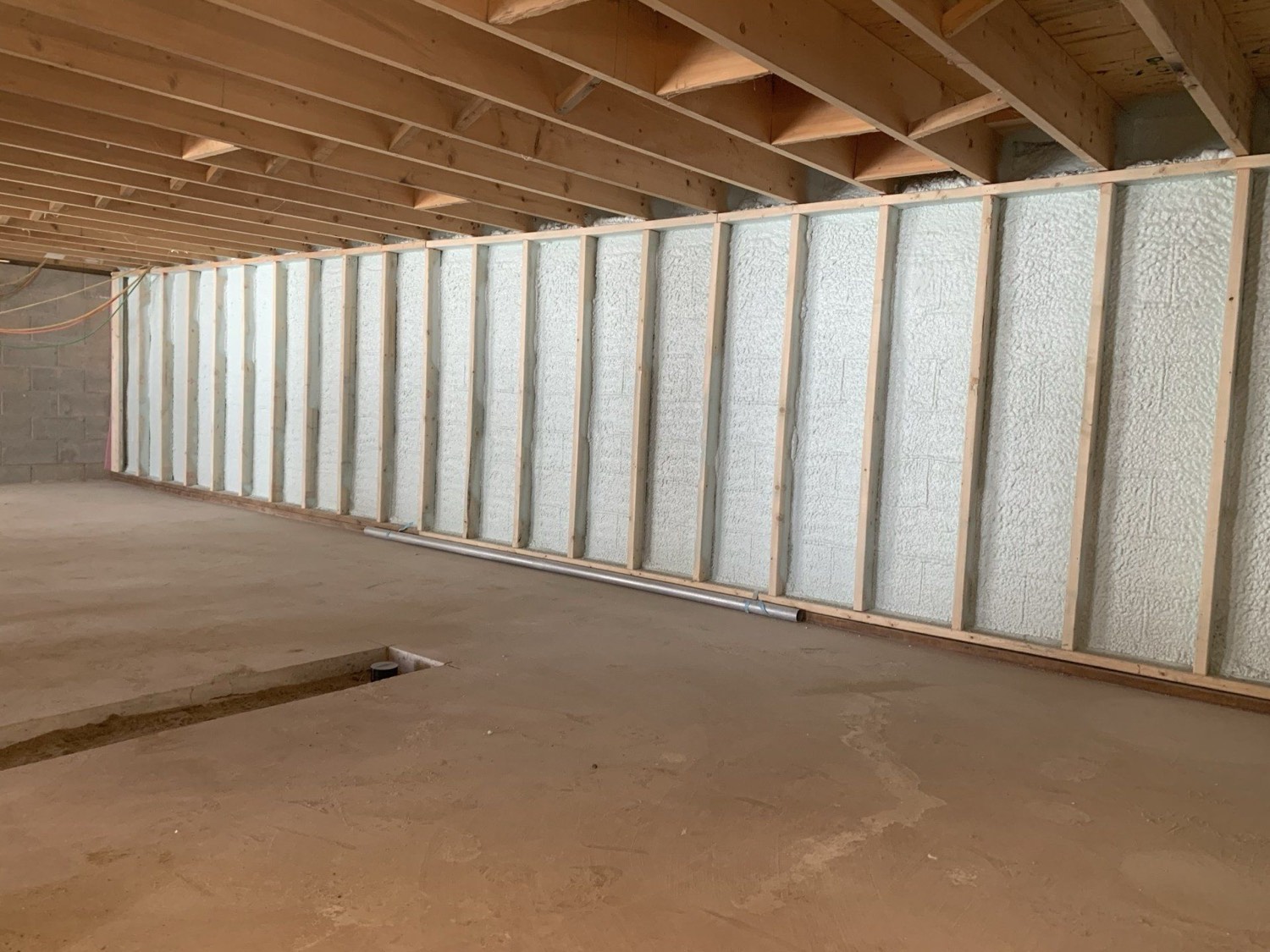 Interior wall covered in closed-cell spray foam insulation
