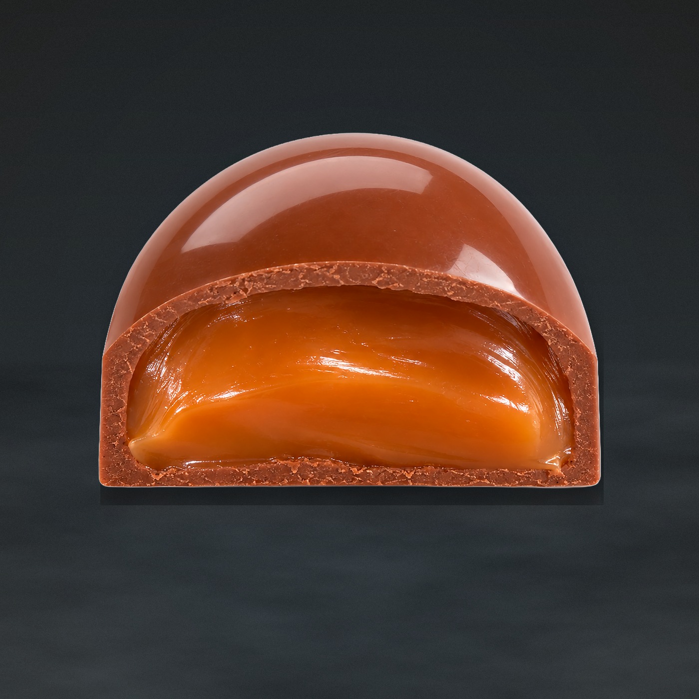 A BYTE salted caramel bonbon cut through, showing the caramel centre